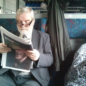 Old man killing time in so slow Polish train