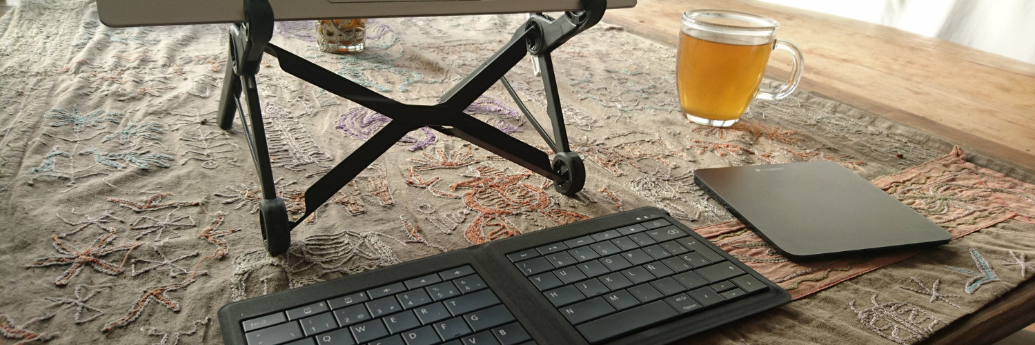 Laptop stand and a cup of tea